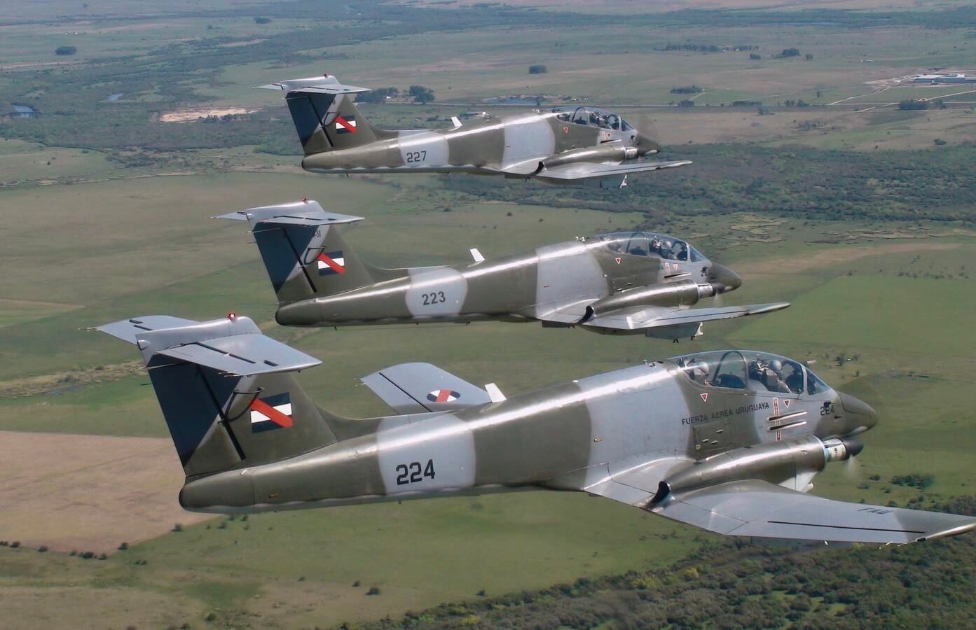 Three FAU Pucará on echelon formation over the Uruguayan countryside. (Escuadrón 1)