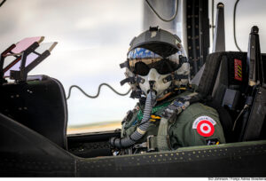 A Peruvian pilot on the cockpit of a FAP KT-1P "Torito" at CRUZEX 2024