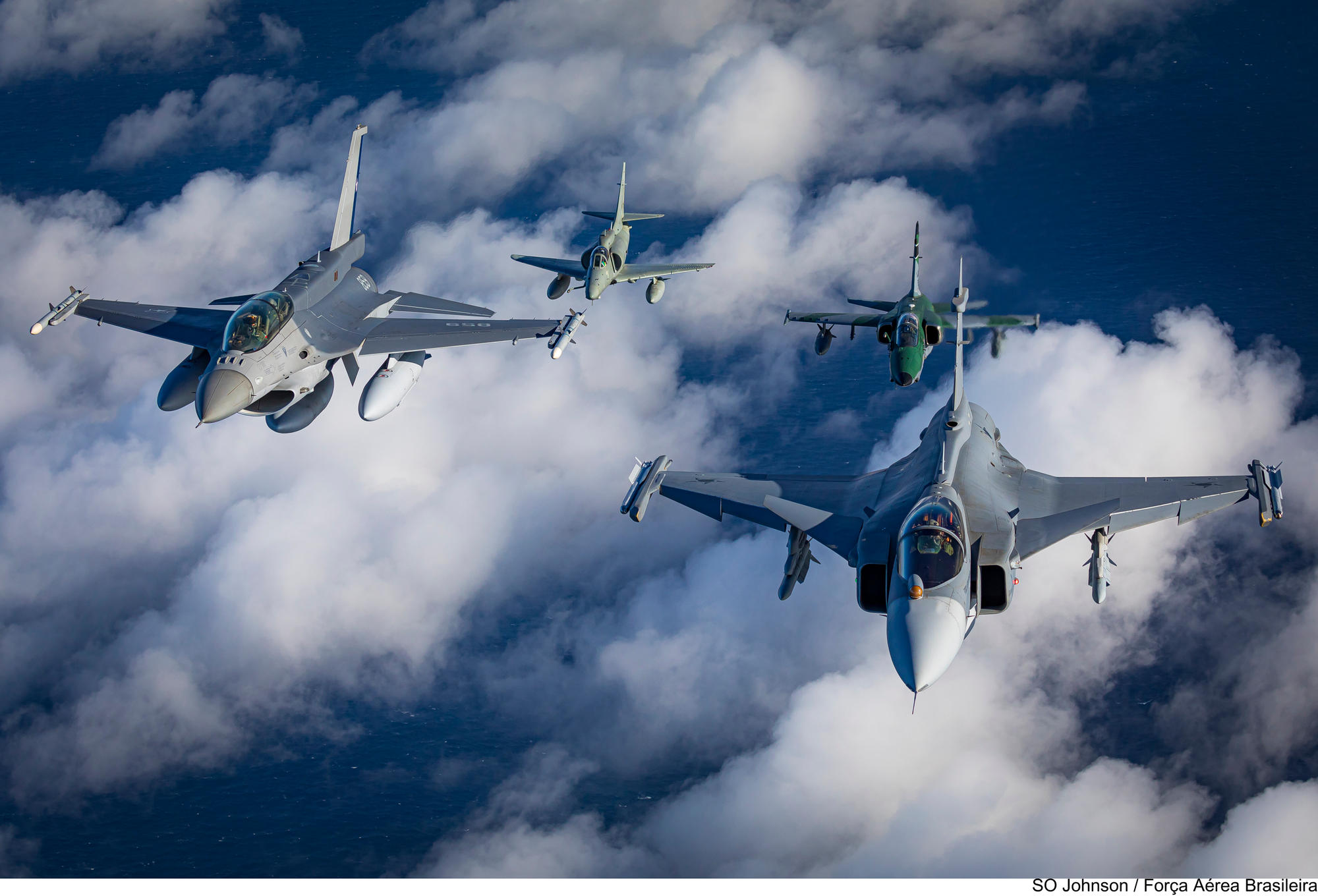 CRUZEX 2024 - A Saab JAS 39 Gripen E from the Brazilian Air Force leads the "fast movers"; escorted by a Chilean F-16D, A-1A (AMX) and a A-4KU from the Brazilian Navy.